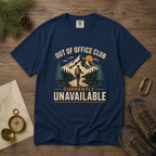 Navy blue t-shirt with outdoor graphic and text on a wooden surface with hiking accessories.
