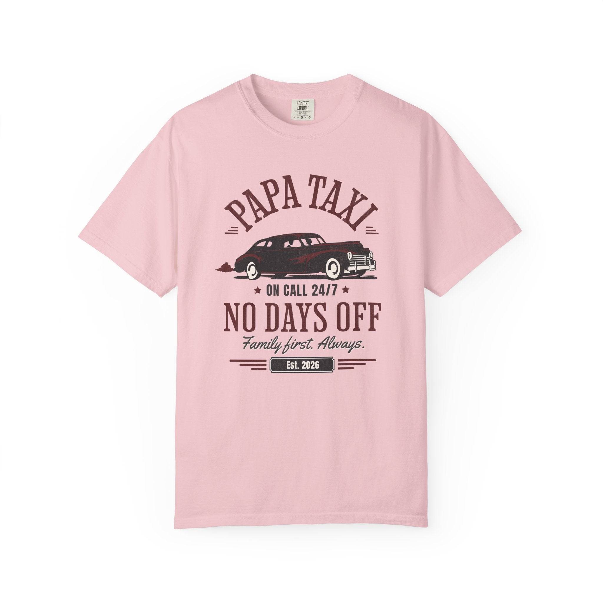 Pink t-shirt with 'Papa Taxi Since 2026' graphic and text on a white background