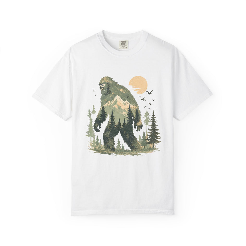 White t-shirt with a graphic of a bigfoot-like creature in a forest design on a white background