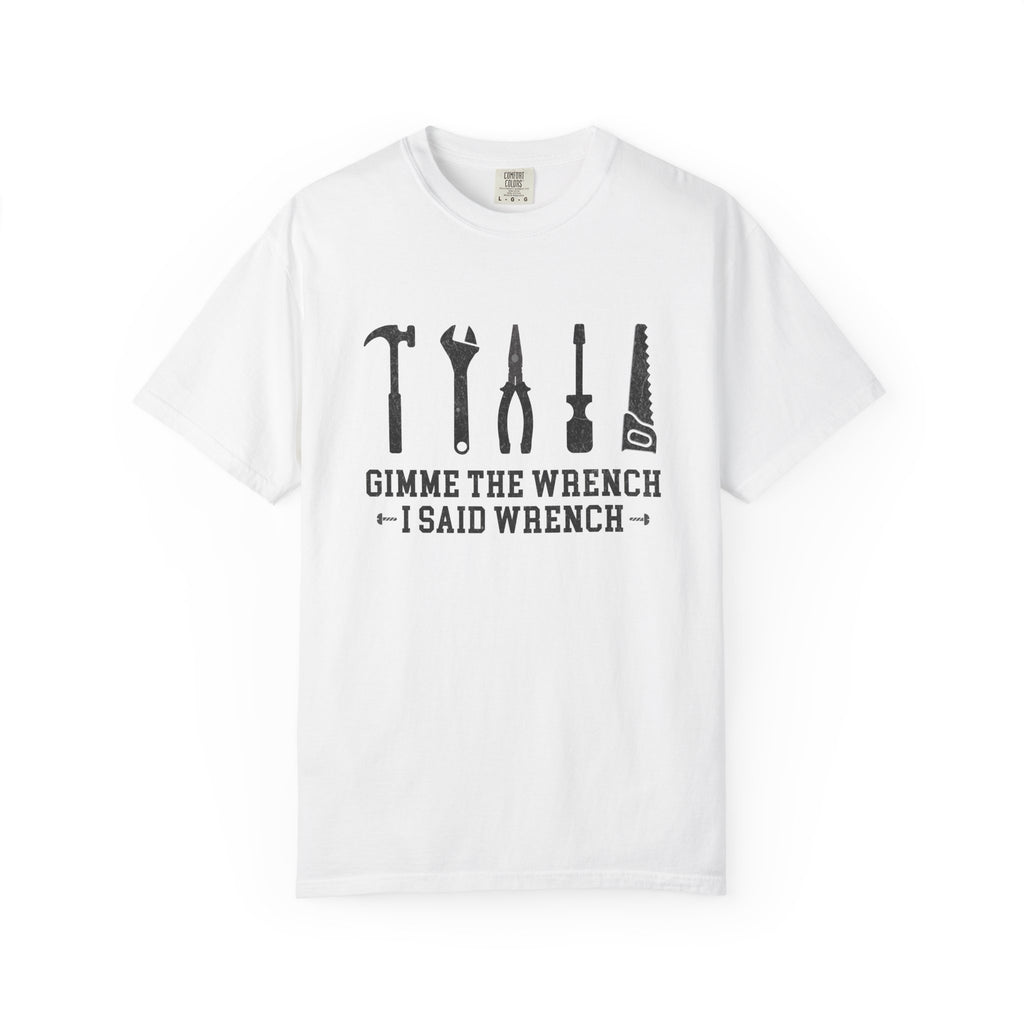 A white short-sleeve crewneck t-shirt featuring a black graphic of various hand tools (hammer, wrench, pliers, screwdriver, saw) above the text 'GIMME THE WRENCH - I SAID WRENCH' in a distressed stencil font.