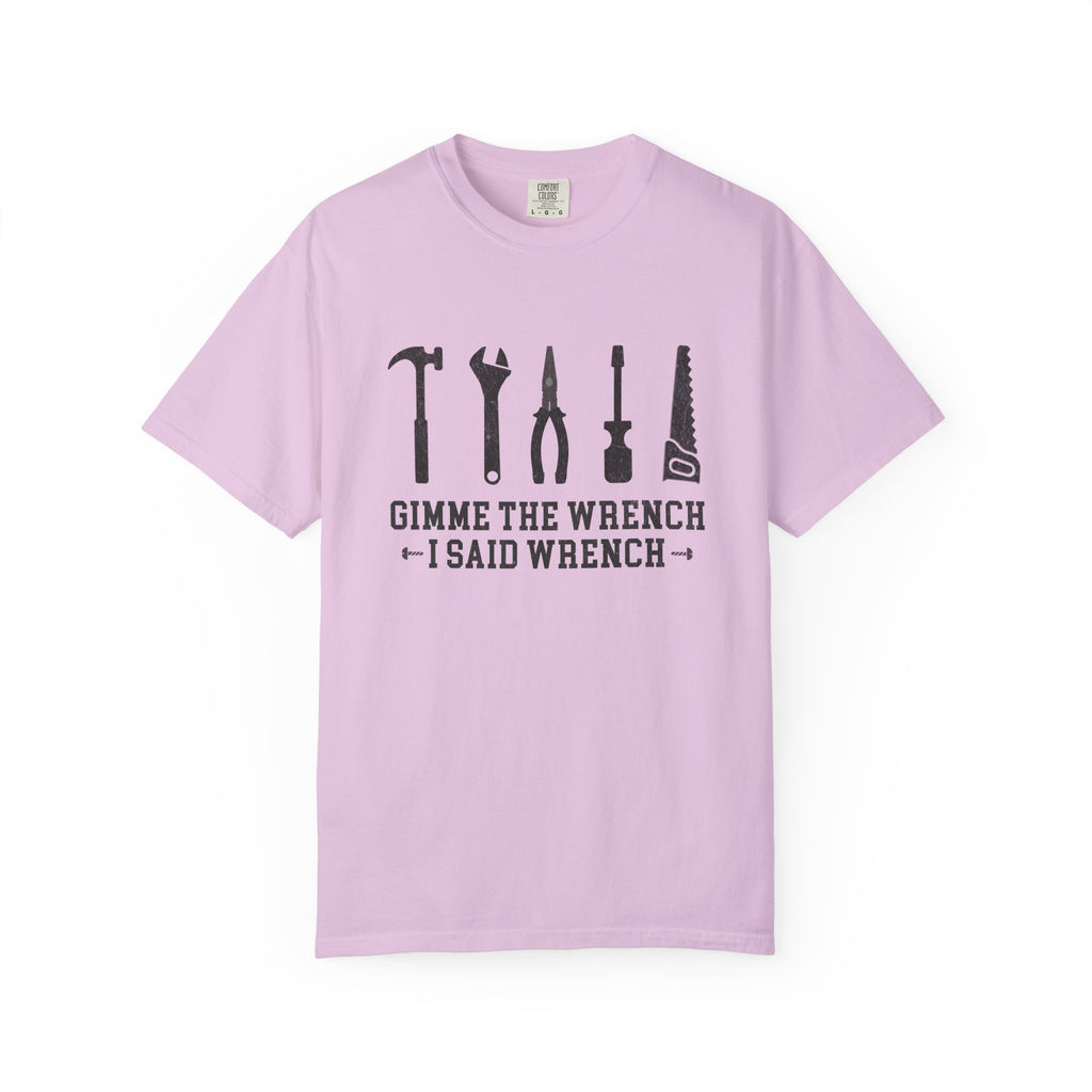 A light purple short-sleeve t-shirt with a black graphic of tools and the text 'GIMME THE WRENCH I SAID WRENCH' on the front, displayed against a plain white background.