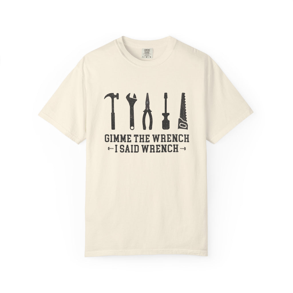An off-white short-sleeve crewneck t-shirt with a black graphic of various hand tools and the text 'GIMME THE WRENCH I SAID WRENCH' printed on the chest, displayed against a plain white background.
