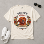 White t-shirt with a Golden Retriever graphic and text on a gray background, accompanied by white sneakers and sunglasses.