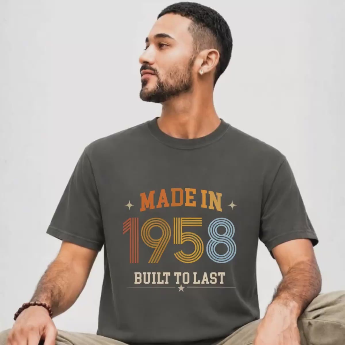 man is wearing a pepper, gray made in 1958 built to last shirt